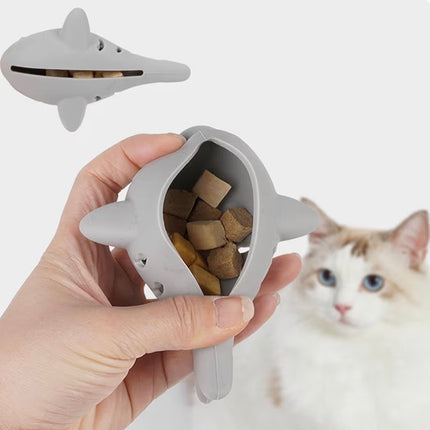 Poisson distributeur de friandises et nettoyant dentaire